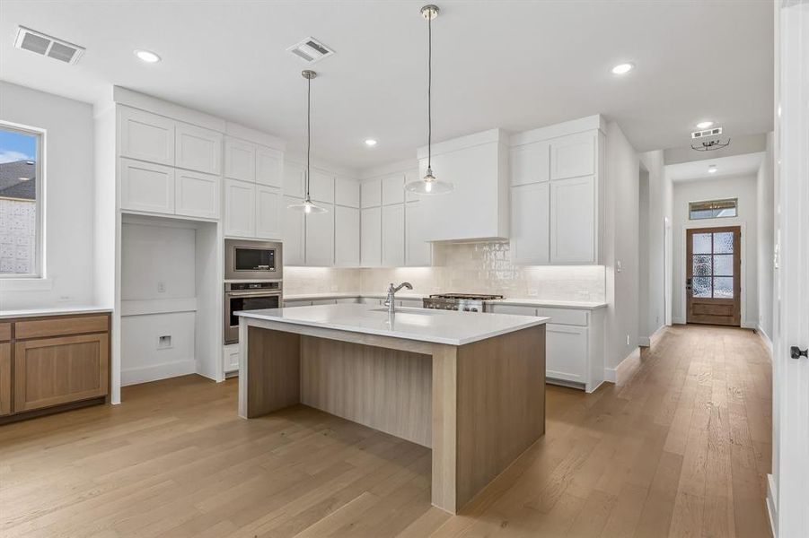 Featuring high ceilings with dual stacked cabinetry and ample prep space, this dream kitchen has it all! Featuring high ceilings with dual stacked cabinetry and ample prep space, this dream kitchen has it all!
