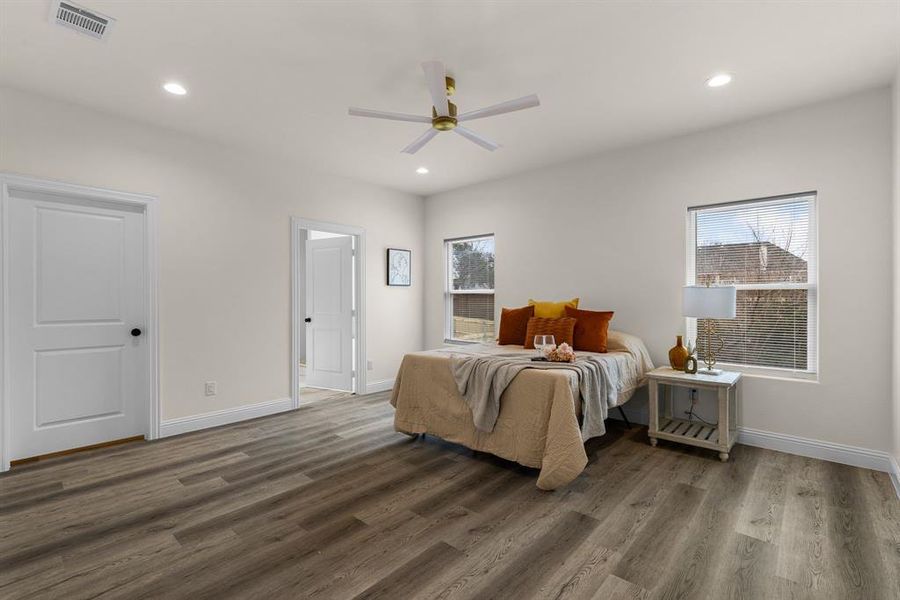 Bedroom featuring dark hardwood / wood-style floors and ceiling fan