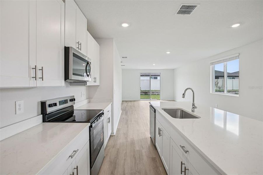 Furnished interior view inside a new home in Two Rivers - Premier Series, Zephyrhills (Image 7). Furnished interior view inside a new home in Two Rivers - Premier Series, Zephyrhills (Image 7).