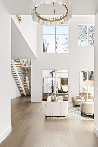 Spacious two-story entry with a modern chandelier