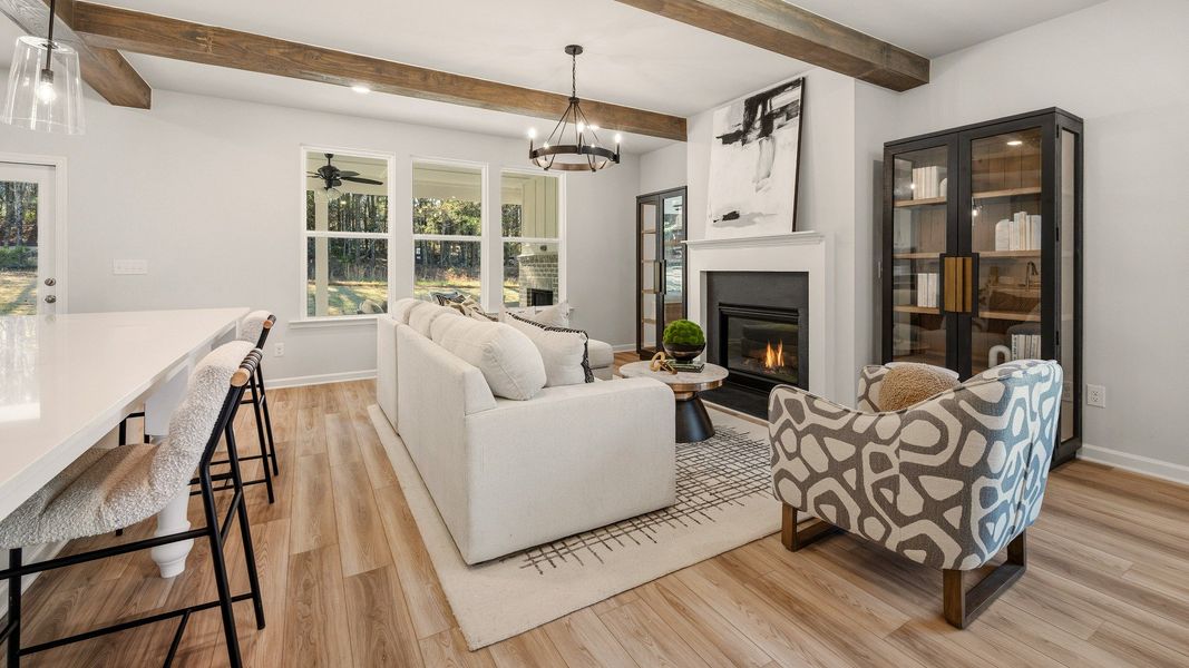 Gathering room with accent ceiling, fireplace, and windows Gathering room with accent ceiling, fireplace, and windows