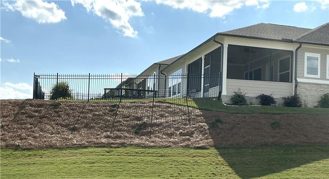 Exterior details and patio area of a home in The Retreat at Sterling on the Lake 48', Flowery Branch (Image 23).