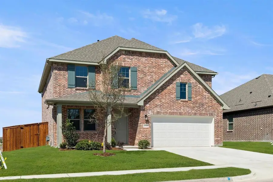 Front exterior of a new home in Gateway Parks, Forney, TX, highlighting curb appeal (Image 15).