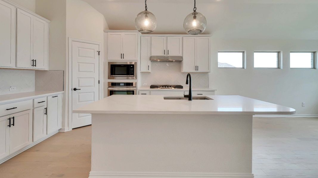 Representative furnished interior of a home built from the Palm by Brightland Homes in Sunterra, Katy (Image 4).