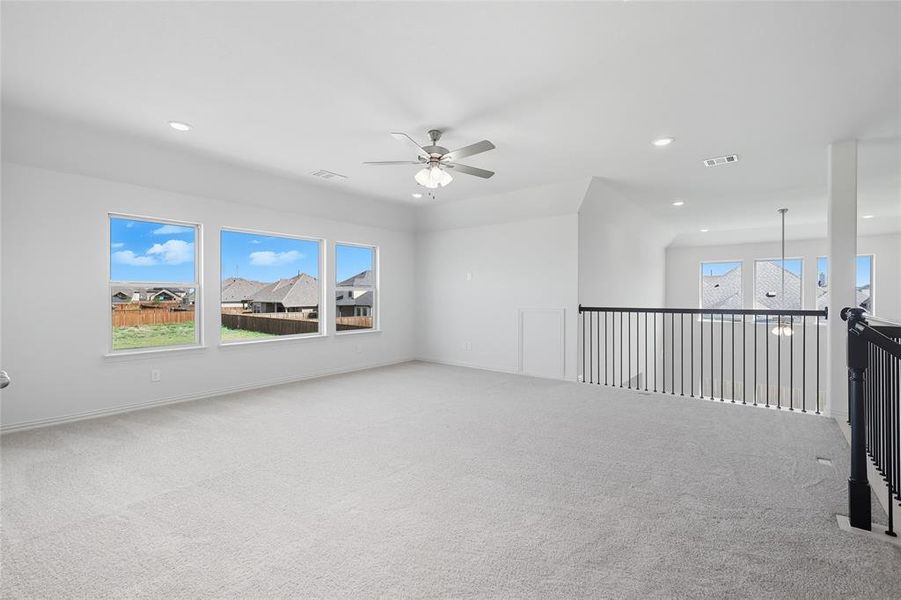 Carpeted spare room featuring ceiling fan and recessed lighting Carpeted spare room featuring ceiling fan and recessed lighting