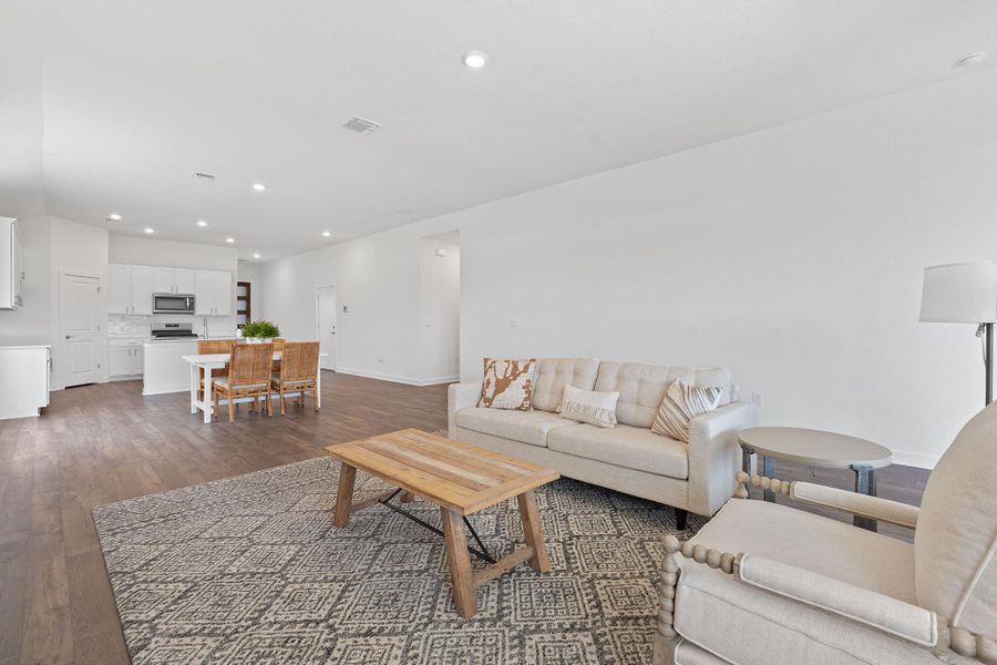 Living area featuring recessed lighting and dark wood finished floors Living area featuring recessed lighting and dark wood finished floors