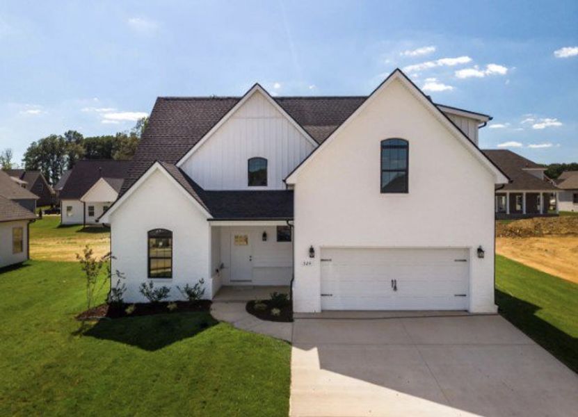 Front exterior of a new home in Cherry Fields, Clarksville, TN, highlighting curb appeal (Image 1). Front exterior of a new home in Cherry Fields, Clarksville, TN, highlighting curb appeal (Image 1).