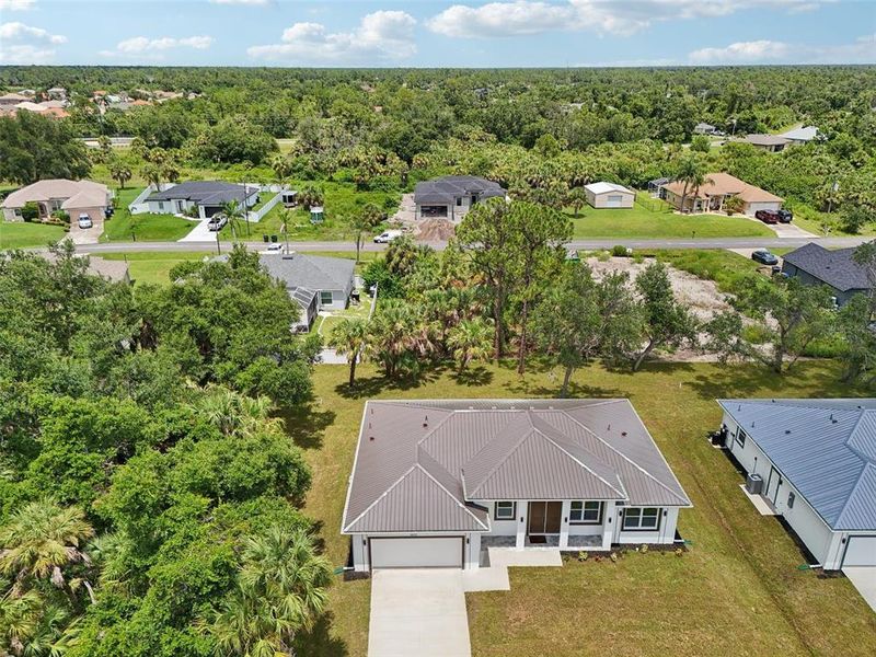 Front exterior of a new home in , North Port, FL, highlighting curb appeal (Image 24).