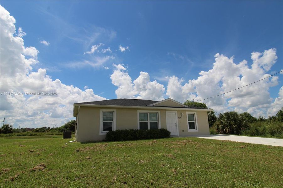 Front exterior of a new home in , Labelle, FL, highlighting curb appeal (Image 13).