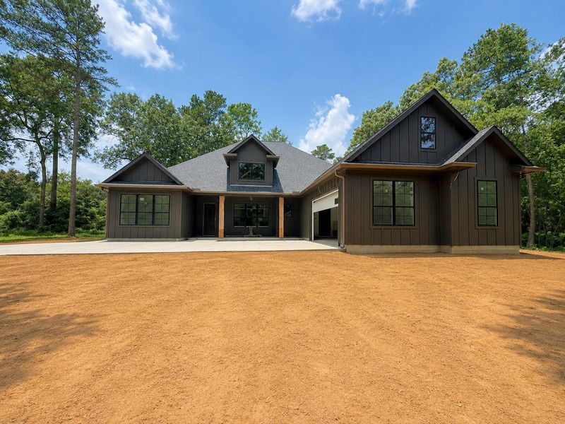 Front exterior of a new home in , Plantersville, TX, highlighting curb appeal (Image 2).