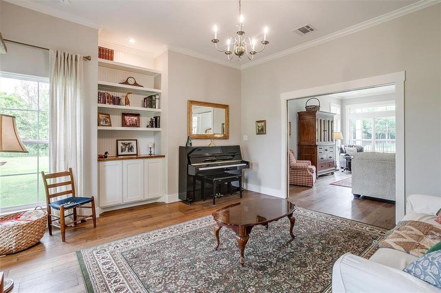 Study with built-in cabinets & shelving. Study with built-in cabinets & shelving.