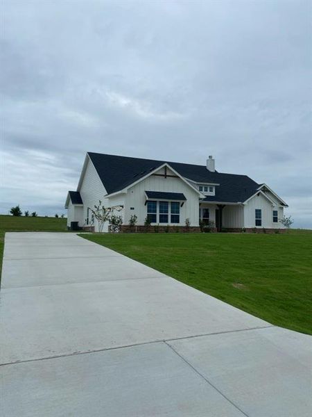 Front exterior of a new home in Hillview Addition, Decatur, TX, highlighting curb appeal (Image 2). Front exterior of a new home in Hillview Addition, Decatur, TX, highlighting curb appeal (Image 2).