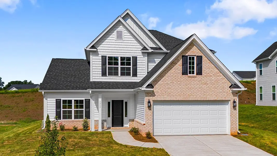 Front exterior of a new home in Brooke Hill, Lewisville, NC, highlighting curb appeal (Image 1). Front exterior of a new home in Brooke Hill, Lewisville, NC, highlighting curb appeal (Image 1).