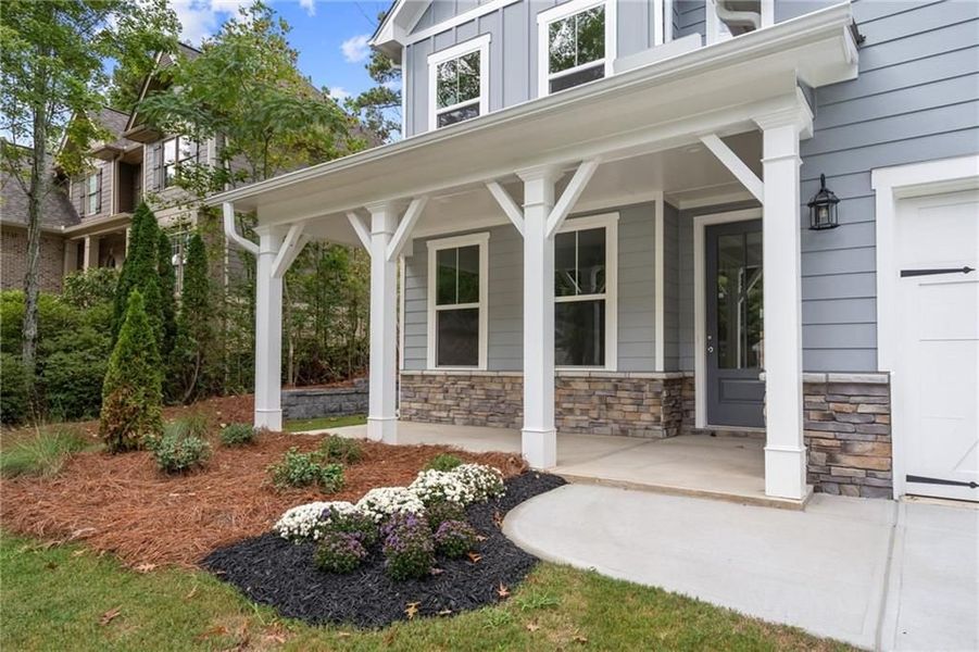 Front exterior of a new home in Riverwood, Dallas, GA, highlighting curb appeal (Image 12). Front exterior of a new home in Riverwood, Dallas, GA, highlighting curb appeal (Image 12).