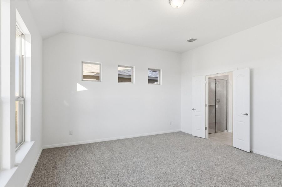 Empty room featuring light carpet