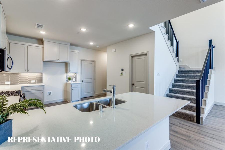 Open and inviting, this gorgeous kitchen is everything you have been searching for!  REPRESENTATIVE PHOTO