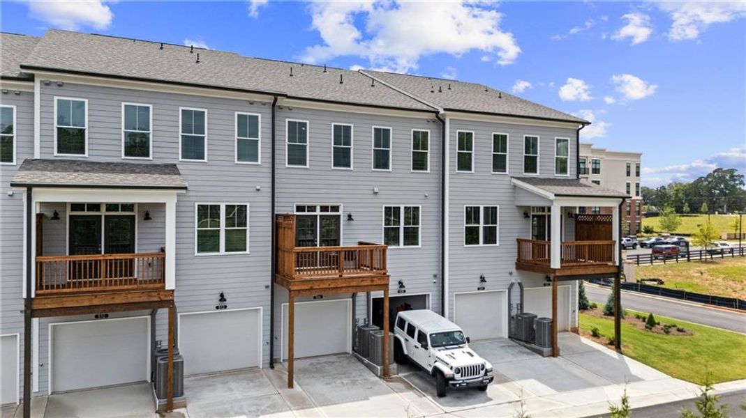 Front exterior of a new home in Market Square at Sawnee Village, Cumming, GA, highlighting curb appeal (Image 19).