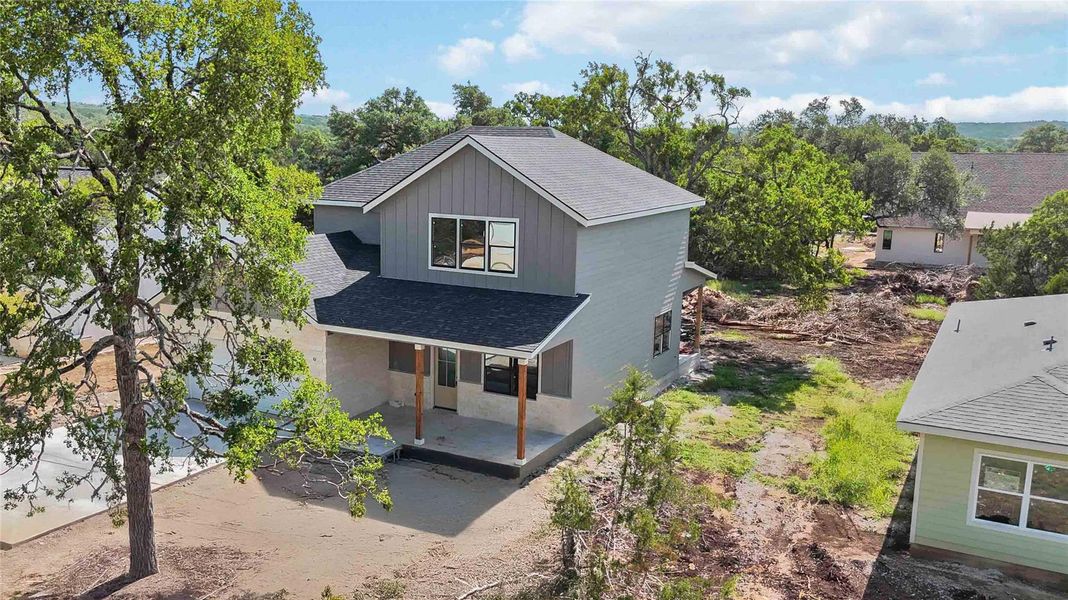 Front exterior of a new home in , Wimberley, TX, highlighting curb appeal (Image 22).