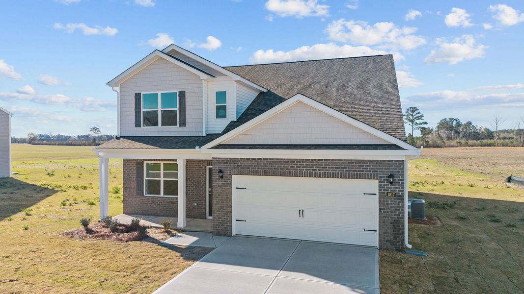 Front exterior of a new home in Beaver Dam Crossing, Bailey, NC, highlighting curb appeal (Image 19). Front exterior of a new home in Beaver Dam Crossing, Bailey, NC, highlighting curb appeal (Image 19).