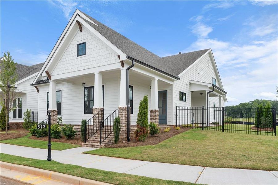 Front exterior of a new home in Promenade at Sawnee Village, Cumming, GA, highlighting curb appeal (Image 20).
