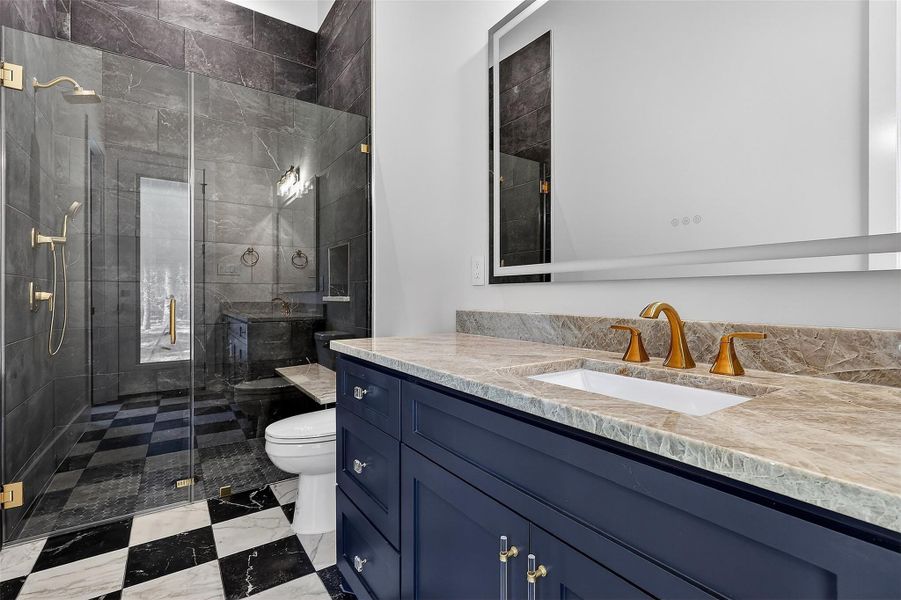 Full bathroom with access to the outside and game room!