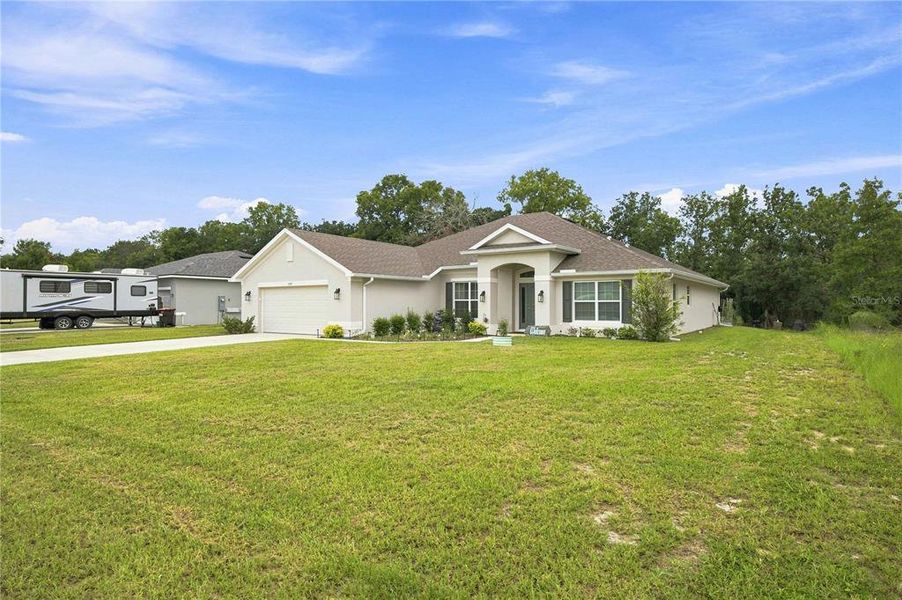 Front exterior of a new home in , Ocala, FL, highlighting curb appeal (Image 2). Front exterior of a new home in , Ocala, FL, highlighting curb appeal (Image 2).