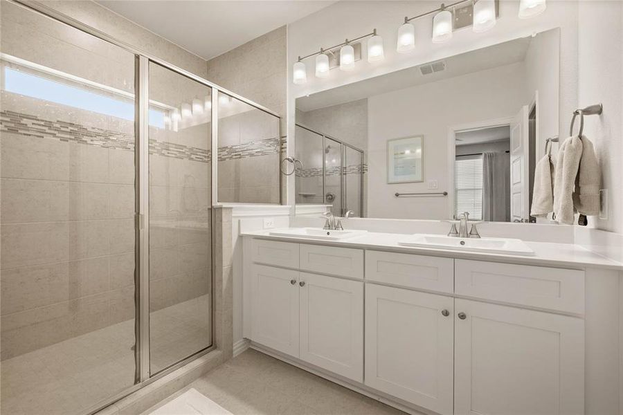 Bathroom with vanity and an enclosed shower