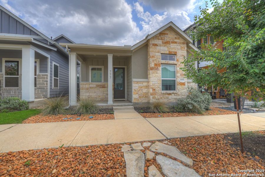 Front exterior of a new home in Town Creek, New Braunfels, TX, highlighting curb appeal (Image 1). Front exterior of a new home in Town Creek, New Braunfels, TX, highlighting curb appeal (Image 1).