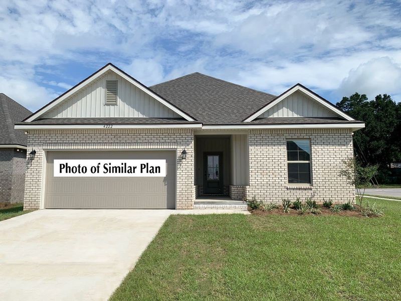 Front exterior of a new home in Sentinel Ridge, Pace, FL, highlighting curb appeal (Image 2). Front exterior of a new home in Sentinel Ridge, Pace, FL, highlighting curb appeal (Image 2).
