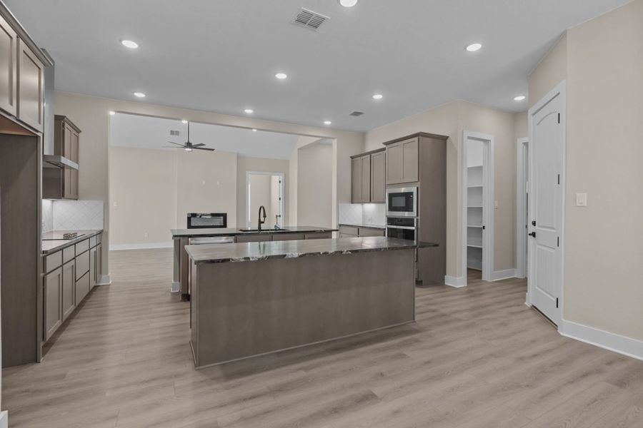 Representative furnished interior of a home built from the Layla by Chesmar Homes in Sienna Lakes, San Antonio (Image 4).