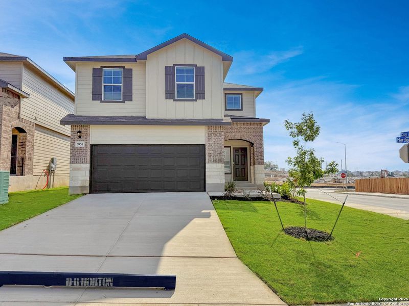 Front exterior of a new home in Stonehill, San Antonio, TX, highlighting curb appeal (Image 2). Front exterior of a new home in Stonehill, San Antonio, TX, highlighting curb appeal (Image 2).
