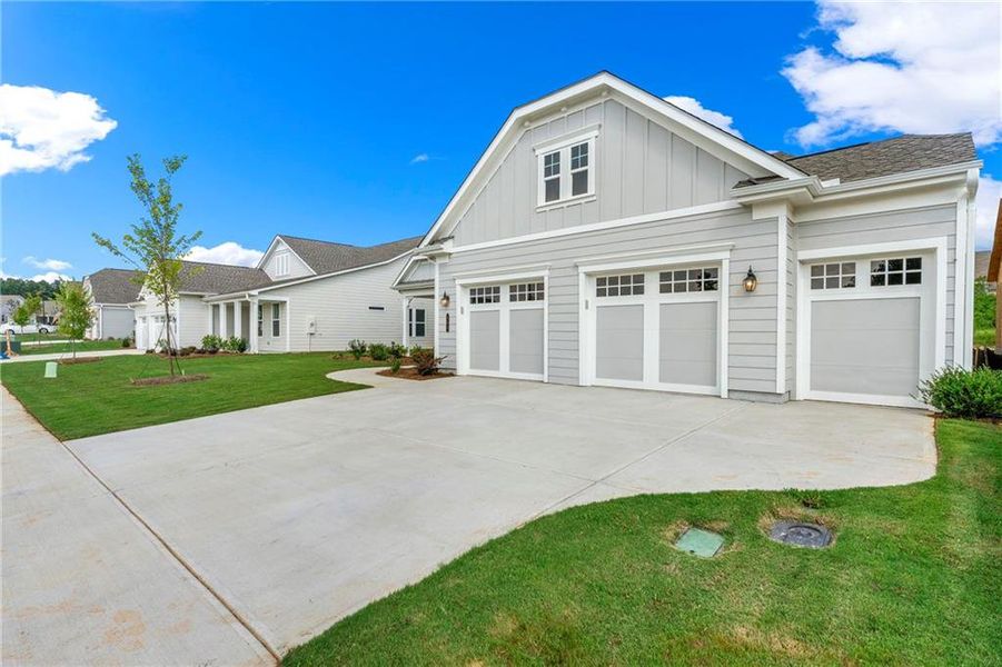 Front exterior of a new home in Cresswind Georgia at Twin Lakes, Hoschton, GA, highlighting curb appeal (Image 21).