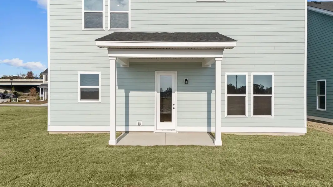 Exterior details and patio area of a home in Blue Heron Retreat, Little River (Image 3).