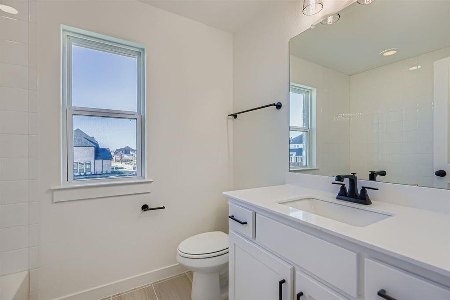 Full bath featuring vanity, a shower, and a tub Full bath featuring vanity, a shower, and a tub