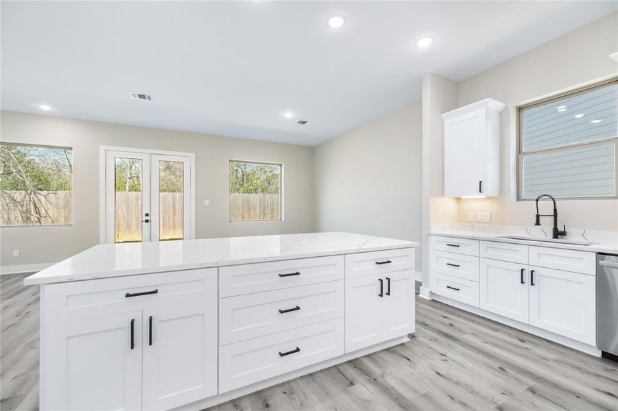 With pots and pans drawers, expansive cabinetry, and the large center island, your new home offers ample storage and plenty of space to prepare and enjoy meals with ease.