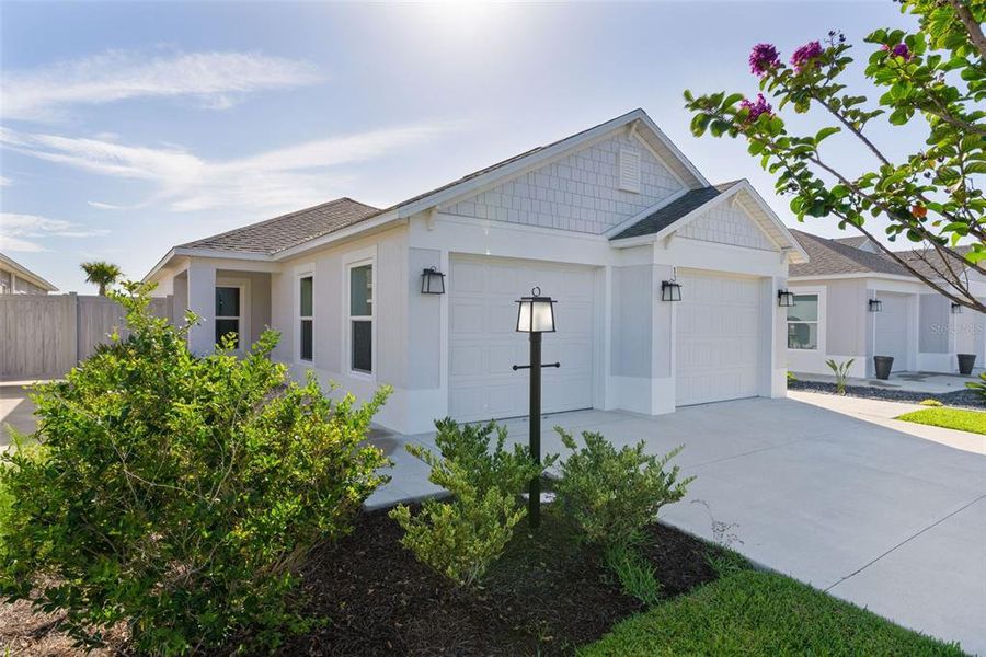 Front exterior of a new home in , The Villages, FL, highlighting curb appeal (Image 28). Front exterior of a new home in , The Villages, FL, highlighting curb appeal (Image 28).