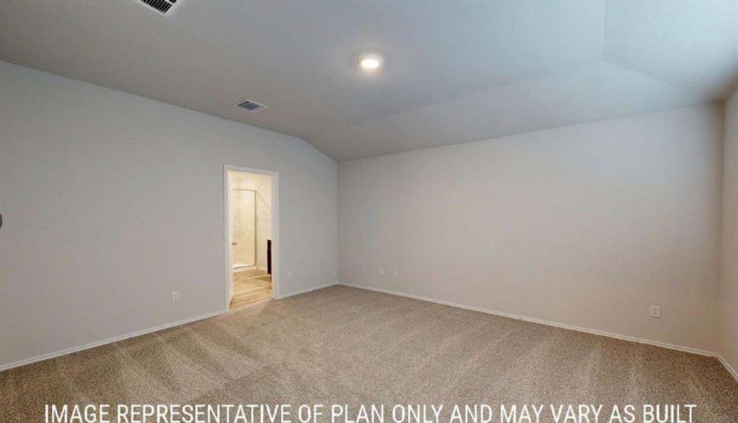 Spacious room featuring neutral carpeting, light-toned walls, and recessed lighting
