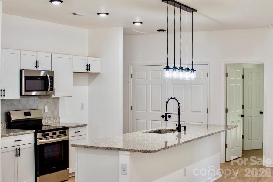 Kitchen and Laundry view from the Living Area.