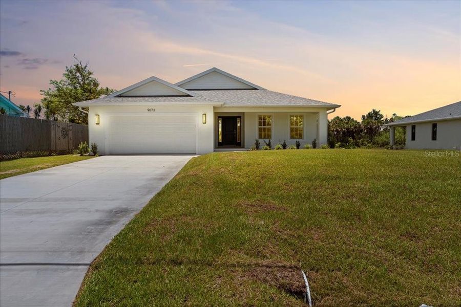 Front exterior of a new home in , Englewood, FL, highlighting curb appeal (Image 2).