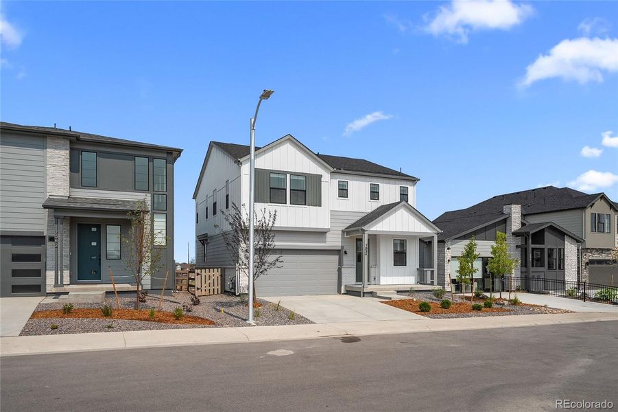 Front exterior of a new home in Harmony at Sterling Ranch, Littleton, CO, highlighting curb appeal (Image 24).