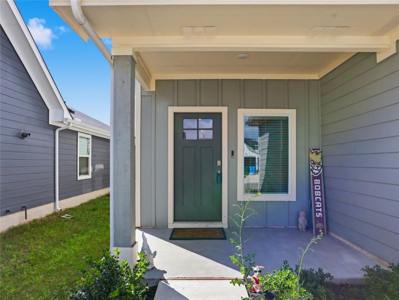 An inviting covered entryway welcomes guests into the home. An inviting covered entryway welcomes guests into the home.