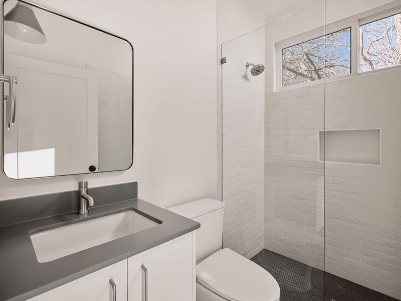 Full bath featuring vanity and walk in shower