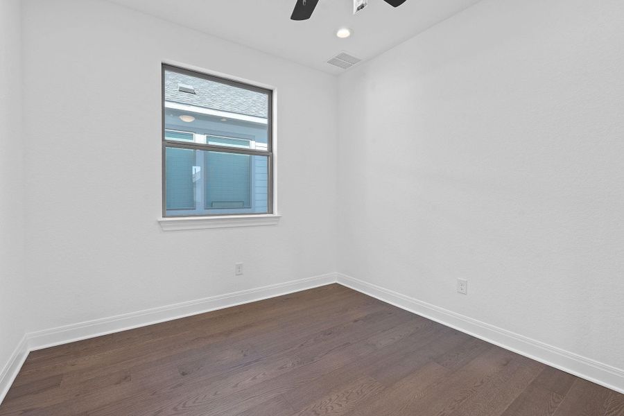 Unfurnished room with dark wood-style floors, recessed lighting, and a ceiling fan Unfurnished room with dark wood-style floors, recessed lighting, and a ceiling fan