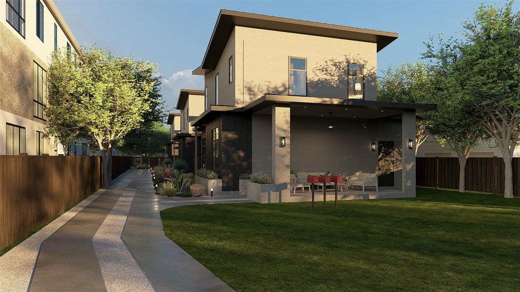 Rear view of property featuring a fenced backyard and stucco siding