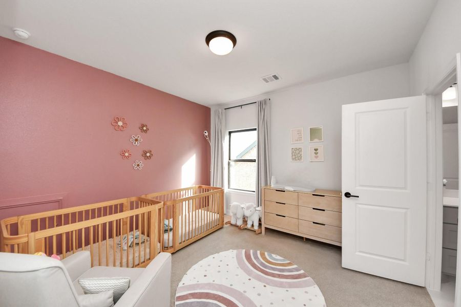 Cozy bedroom suitable for nursery, guest, or home office use.