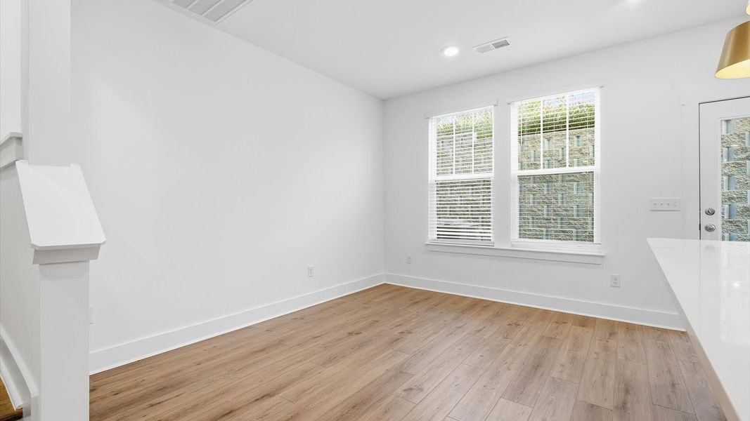 Inviting breakfast area with a seamless connection to the kitchen for everyday living in Arden, NC