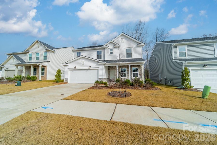Front exterior of a new home in Stewarts Landing, Charlotte, NC, highlighting curb appeal (Image 21).