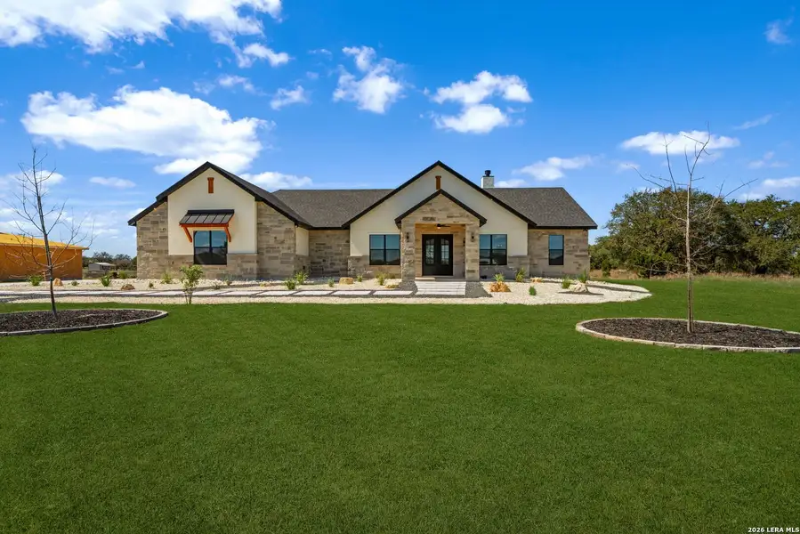 Front exterior of a new home in , Bandera, TX, highlighting curb appeal (Image 2). Front exterior of a new home in , Bandera, TX, highlighting curb appeal (Image 2).
