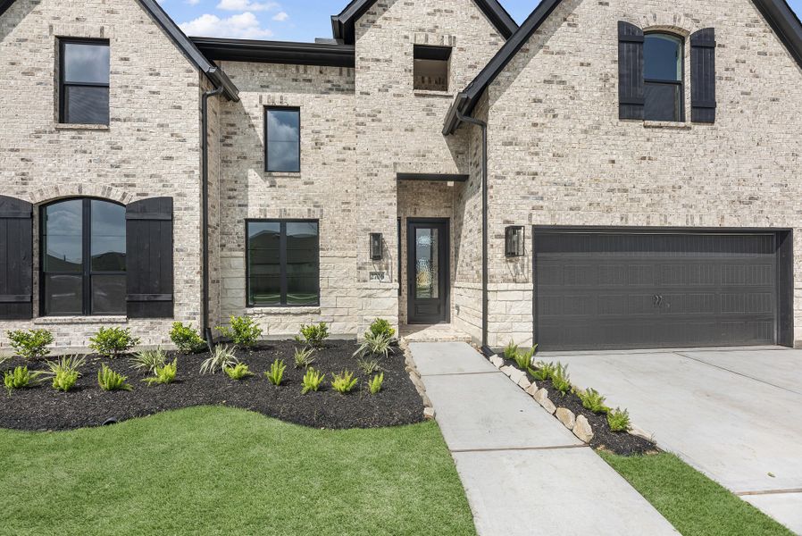 Front exterior of a new home in Jordan Ranch, Katy, TX, highlighting curb appeal (Image 17).