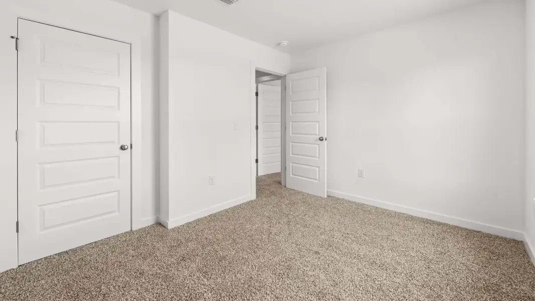 Spacious, unfurnished interior of a new home in Magnolia at the Bluffs Phase 3, Freeport (Image 21).